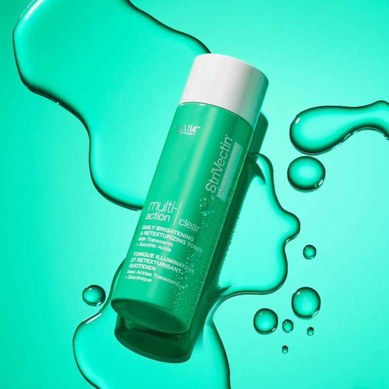 Multi-Action Clear Daily Brightening & Retexturizing Toner on textured green background